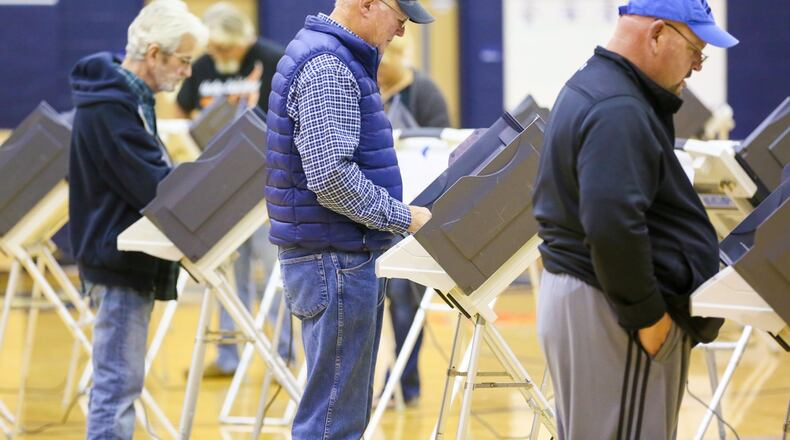 Voters cast their ballots at the Edgewood Middle School polling place, Tuesday, Nov. 8, 2016. GREG LYNCH / STAFF