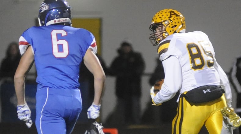 Alter’s Justin “JP” Schimpf (right) out-races Zack Dillow to score on a 42-yard pass from Ryan Markoff. Alter played Clinton-Massie in a D-IV, Region 16 high school football regional semifinal at Centerville on Friday, Nov. 11, 2016. MARC PENDLETON / STAFF