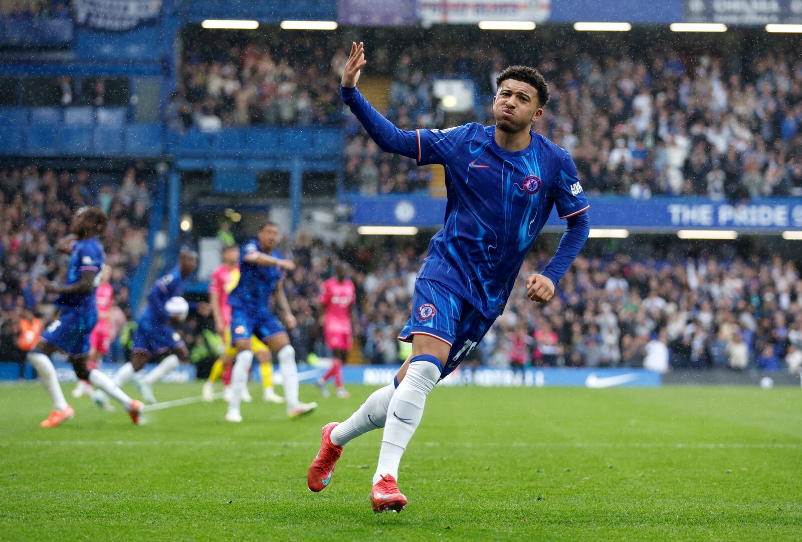Chelsea's Jadon Sancho celebrates scoring their side's second goal of the game during the English Premier League soccer match between Chelsea and Ipswich Town at Stamford Bridge in London, Sunday April 13, 2025. (Nigel French/PA via AP)