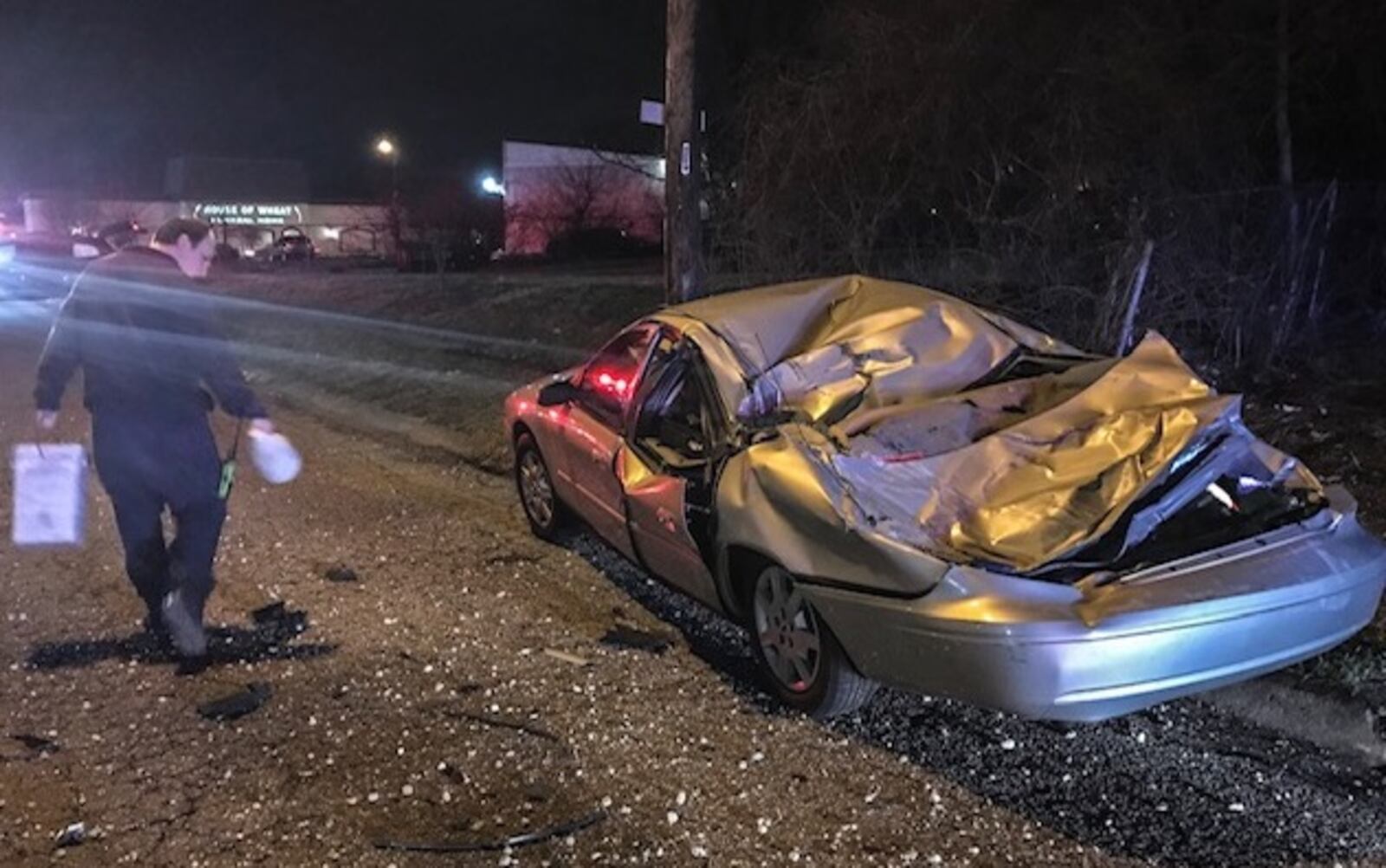 A stolen minivan with two teenage occupants crashed into a gravel pile before going airborne and crushing the top of this parked car on March 21, 2019, on Lori Sue Avenue in Dayton. The minivan then sideswiped another parked car before coming to rest.