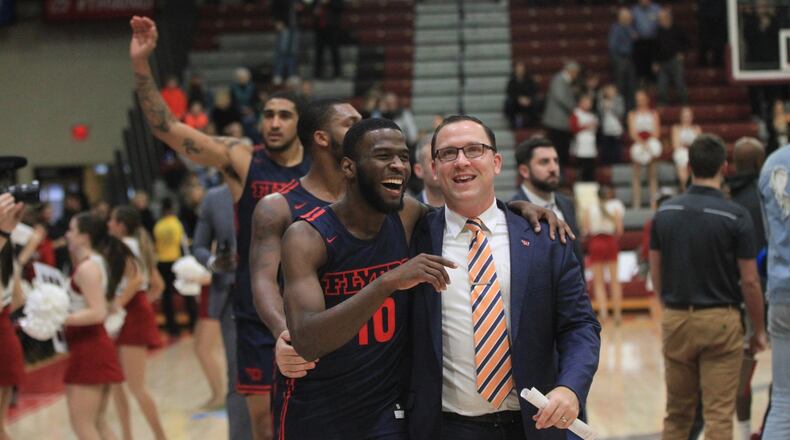 Dayton’s Jalen Crutcher and Andy Farrell leave the court after a victory against Saint Joseph’s on Sunday, Jan. 5, 2020, at Hagan Arena in Philadelphia. David Jablonski/Staff