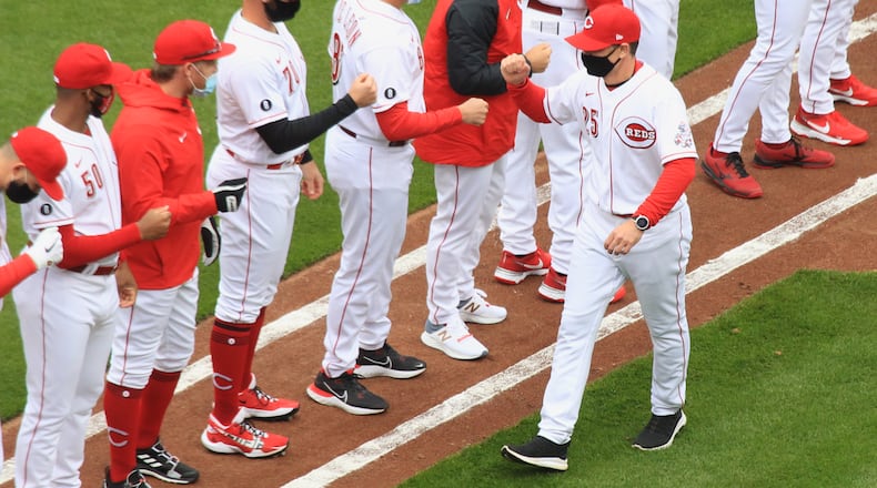 Reds manager David Bell is introduced in a pregame ceremony on Opening Day on Thursday, April 1, 2021, at Great American Ball Park in Cincinnati. David Jablonski/Staff