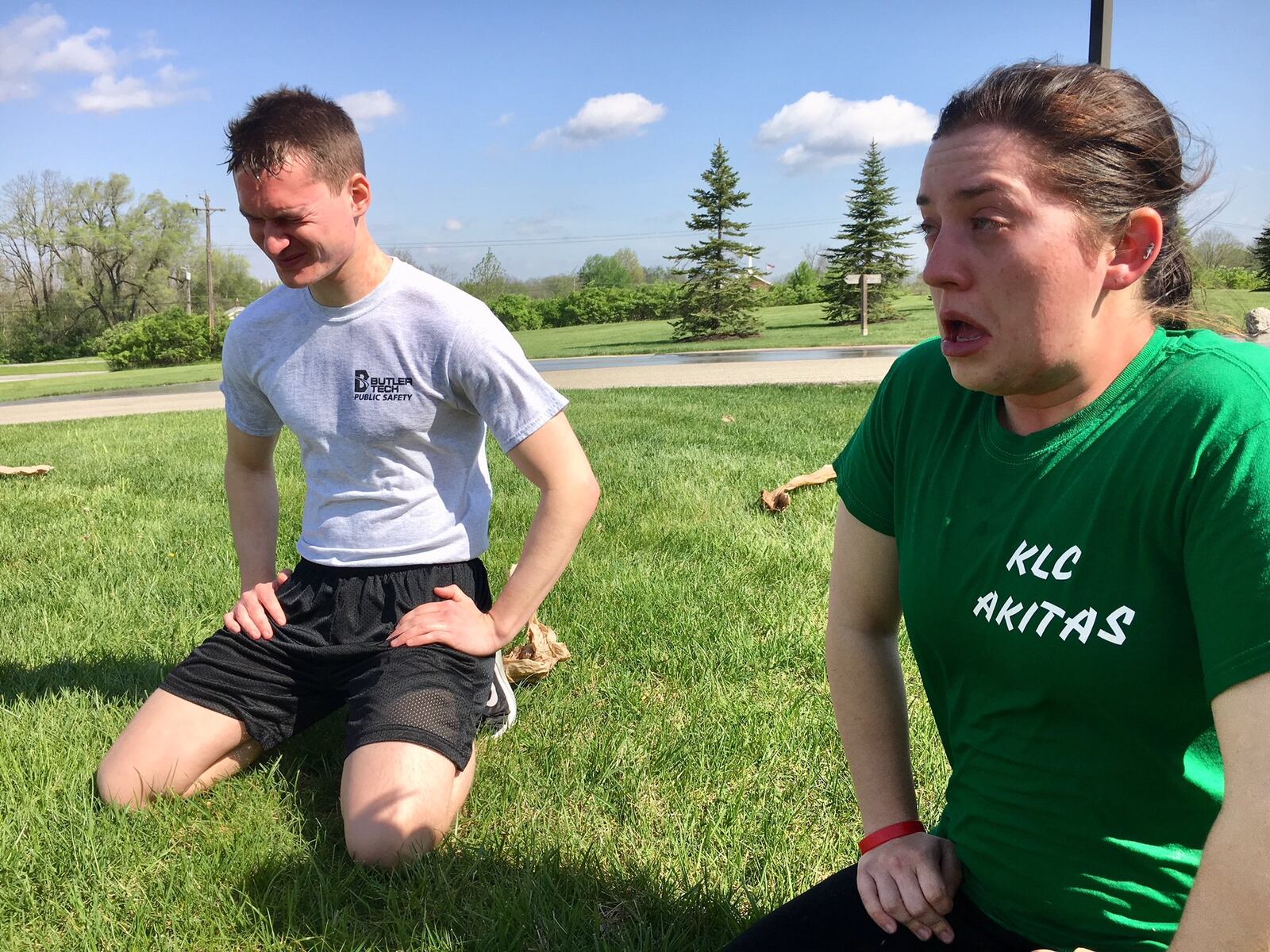 Butler Tech Police Academy students attempt to recover after taking shots of pepper spray directly in their faces. The exercise prepares them should they accidentally be sprayed while wrestling a suspect. 