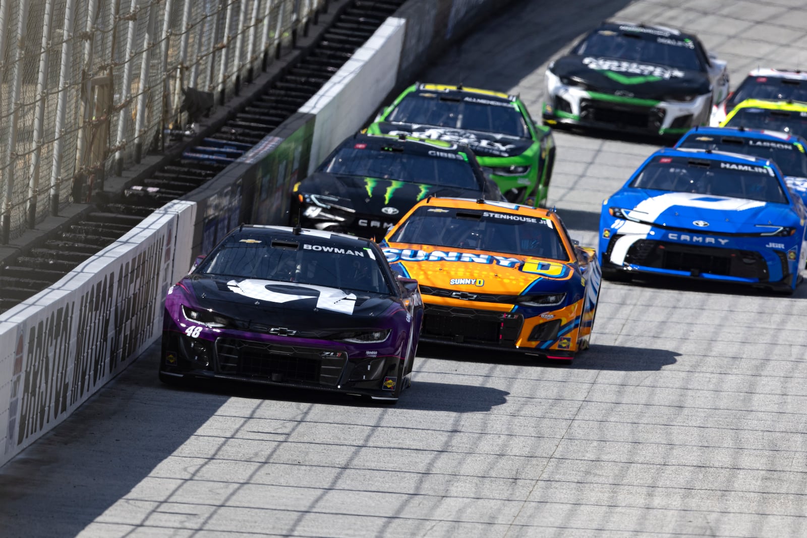 Alex Bowman (48) leads Ricky Stenhouse Jr. (47), Denny Hamlin (11), and others during the start of a NASCAR Cup Series auto race, Sunday, April 13, 2025, in Bristol, Tenn. (AP Photo/Wade Payne)