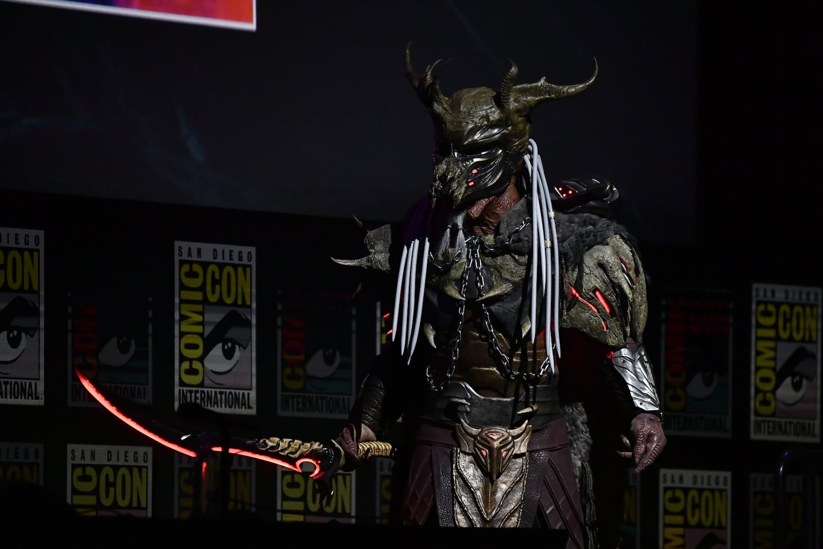A person dressed as the character predator attends a panel for "Predator: Badlands" during Comic-Con International on Friday, July 25, 2025, in San Diego. (Photo by Richard Shotwell/Invision/AP)