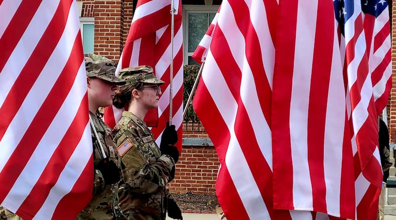 Cadets in the Beavercreek JROTC program march in the Dayton VA Veterans Day Parade, Nov. 8, 2025. LONDON BISHOP/STAFF
