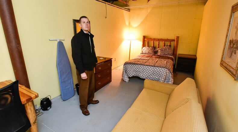 Rob Merrill, youth pastor at Calvary Tabernacle Church, shows off the motel-style rooms in the basement of the church Friday, March 16. Calvary Tabernacle Church in Madison Twp. is developing the City of Refuge Mission to help families displaced as a result of the opioid epidemic. The church is building 14 motel-style living units to become temporary housing for women and children who have been displaced following the sudden death of a family member or if they feel endangered in their current living arrangements. It will also provide long-term housing and care for abandoned children. The facility will have a large commercial kitchen, provide services to help to find long term housing and job search solutions. It will also provide counseling services to assist in the recovery process as well as nurses to provide health checks and physician referrals.The facility is not open yet but the church hopes to partner with other social service agencies and churches. NICK GRAHAM/STAFF