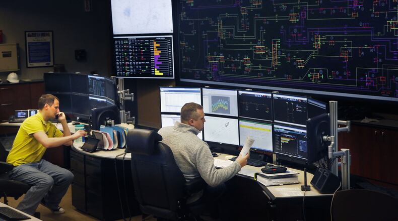 A forecast including freezing rain, snow and gusty winds has Dayton Power & Light preparing line crews for the possibility of power line damage over the weekend. This photo shows the DP&L command and dispatch center in Moraine. TY GREENLEES / STAFF