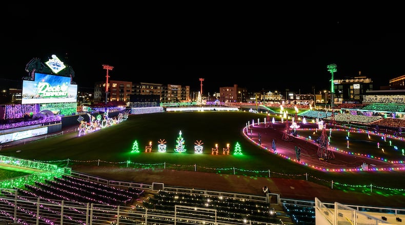 The first season of Deck the Diamond, a new Dayton holiday tradition at Day Air Ballpark, home of the Dayton Dragons, started on Nov. 14 and continues through Jan. 3, 2026. The family-friendly 45-night ticketed event features a winter wonderland of lights and decorations, tasty holiday treats and beverages, holiday shopping, the North Pole Express, a 44-foot-tall Christmas tree, photos with Santa and more. TOM GILLIAM/CONTRIBUTING PHOTOGRAPHER