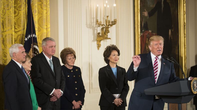 President Donald Trump speaks before signing a decision memo and a letter to members of Congress outlining a plan for privatizing the nation’s air traffic control system, in the East Room of the White House, in Washington, June 5, 2017. At left: Vice President Mike Pence, and second from right, Transportation Secretary Elaine Chao. (Stephen Crowley/The New York Times)
