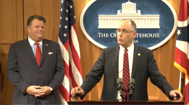 University of Dayton president Eric Spina, center, speaks at a press conference on Monday regarding the state's "brain drain" of college students leaving to take jobs elsewhere. Ohio State Rep. Jon Cross (R-Kenton) looks on. Contributed by Ohio Channel.