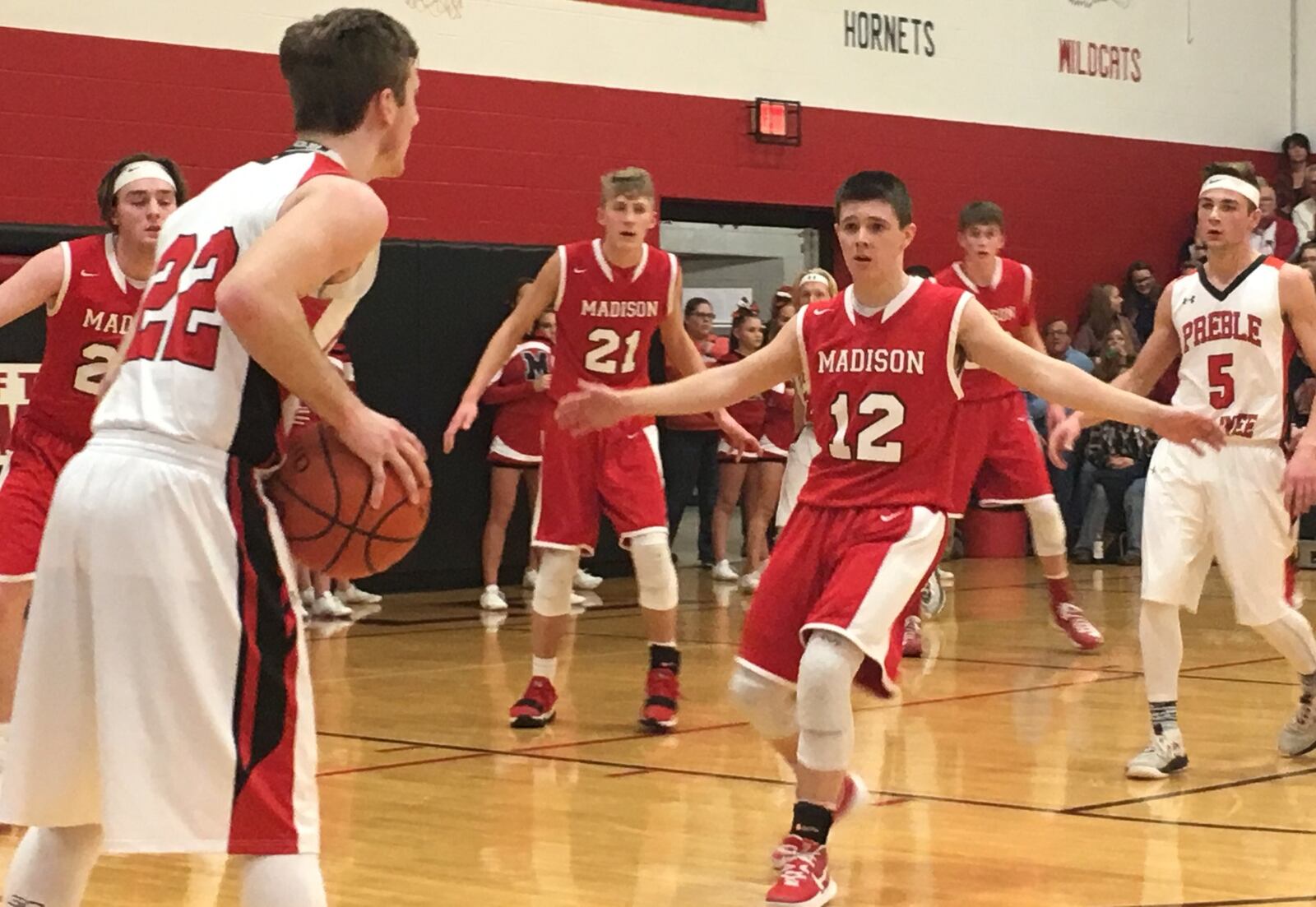 Madison’s Cameron Morgan (12) applies some defensive pressure to Preble Shawnee’s Austin Moore (22) during Friday night’s game at Shawnee. RICK CASSANO/STAFF
