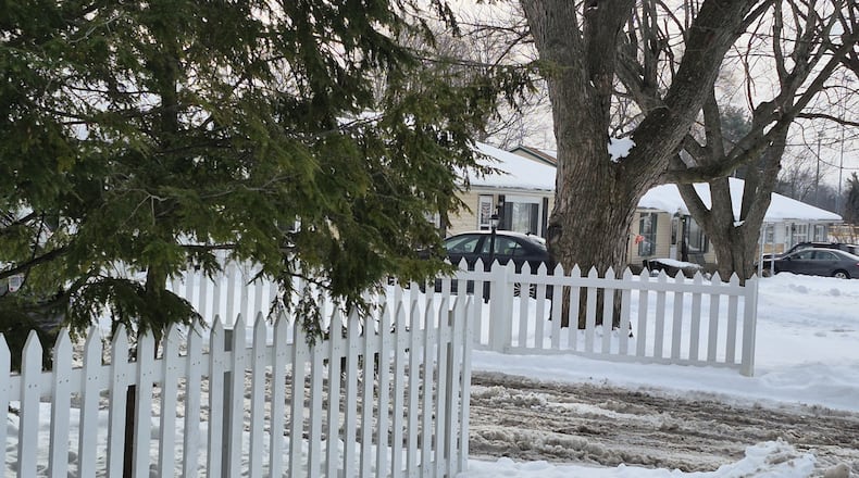 A Centerville pilot program would reimburse 50% of the cost up to $5,000 for exterior home improvements such as fence painting and repair, driveways and roof projects. MICHAEL KURTZ / STAFF