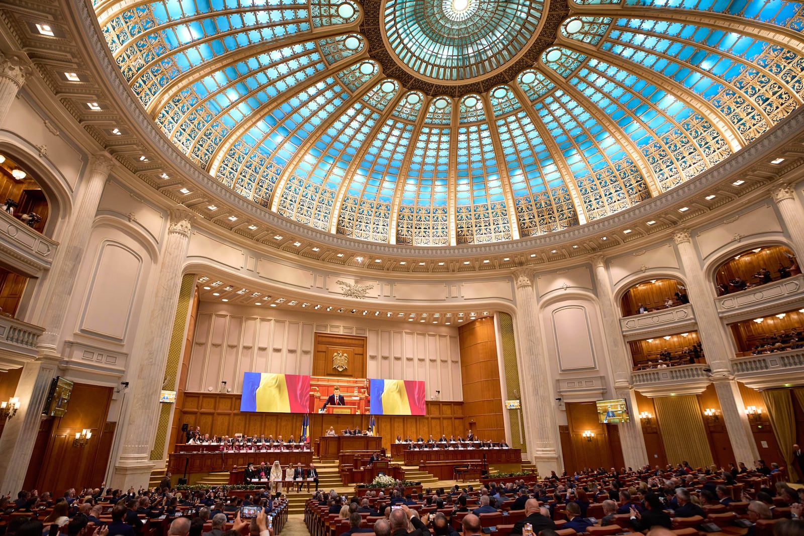 Romania’s newly elected president Nicusor Dan takes the oath as he is sworn in, at the parliament in Bucharest, Romania, Monday, May 26, 2025. (AP Photo/Vadim Ghirda)