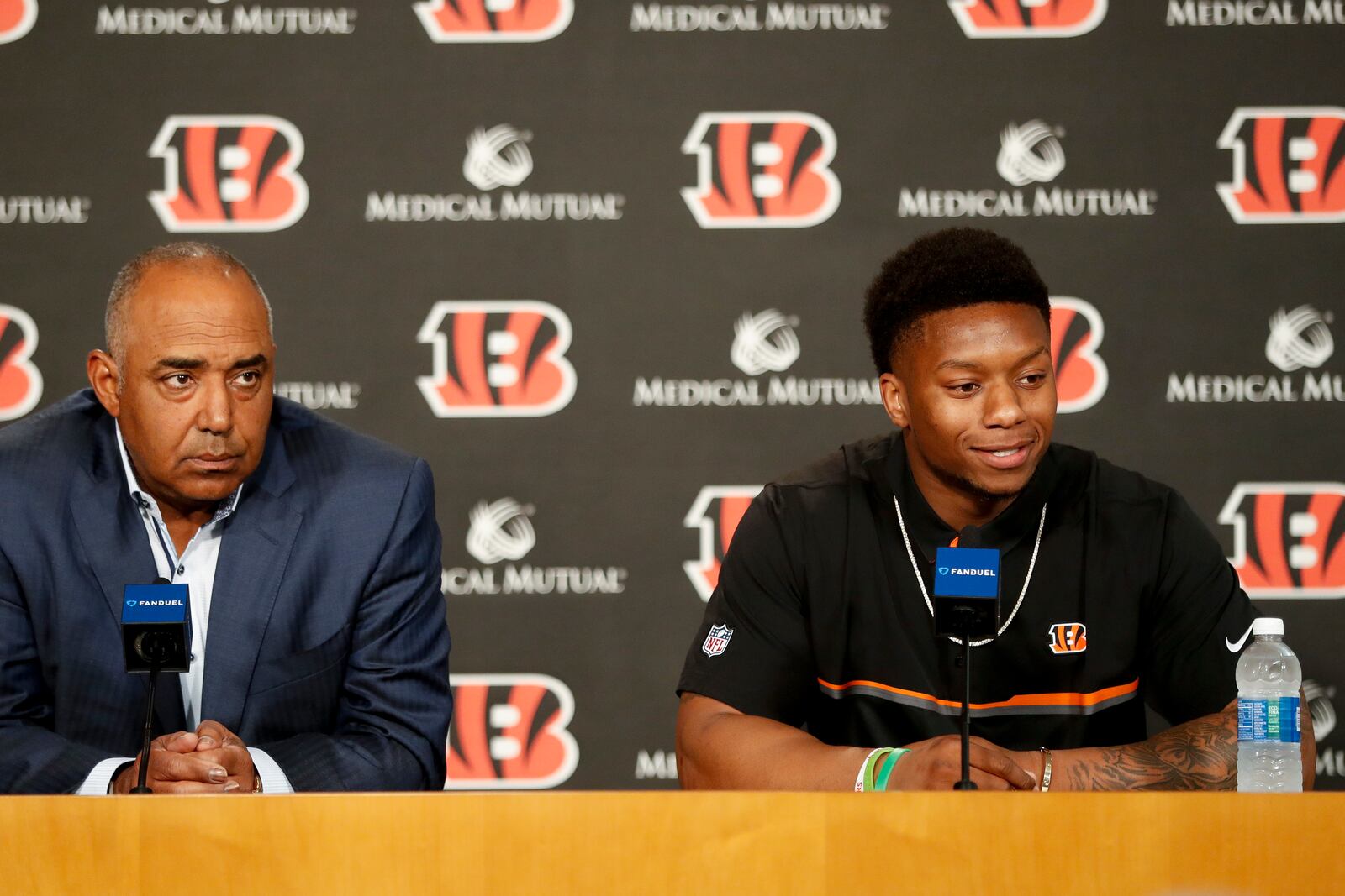Cincinnati Bengals second-round draft pick Joe Mixon, right, is interviewed alongside head coach Marvin Lewis, left, during a news conference at Paul Brown Stadium, Saturday, April 29, 2017, in Cincinnati. The former Oklahoma running back was selected as the 48th overall pick. (AP Photo/John Minchillo)
