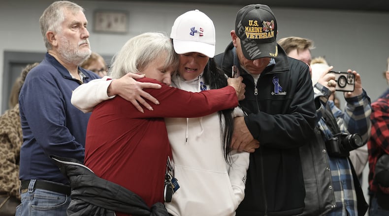 People gather for a vigil in honor of National Guard member Specialist Sarah Beckstrom, one of two National Guard members who were shot in Washington on Wednesday, in Webster Springs, W.Va., Friday, Nov. 28, 2025. (AP Photo/Kathleen Batten)