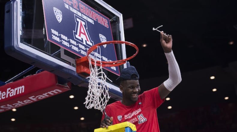 In a March 3, 2018, file image from Tucson, Ariz., Arizona's Deandre Ayton smiles after cutting the net after winning the regular season Pac 12 Conference Championship. (Jeff Brown/Zuma Press/TNS)