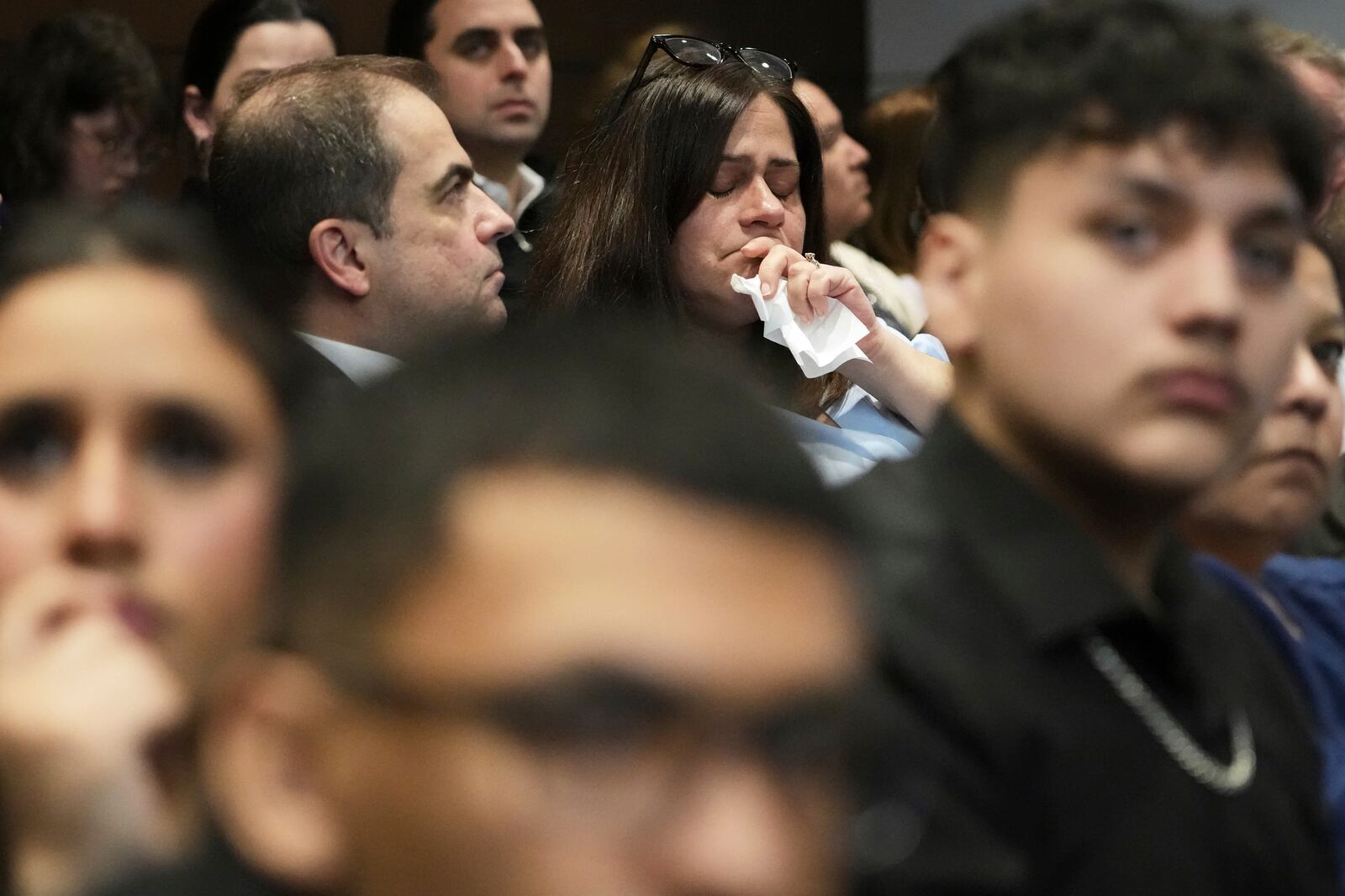 Elizabeth Turnipseed, top right, and Victims family members react during the sentencing hearing for Robert E. Crimo III., at the Lake County Courthouse, in Waukegan, Ill., Wednesday, April 23, 2025. (AP Photo/Nam Y. Huh, Pool)