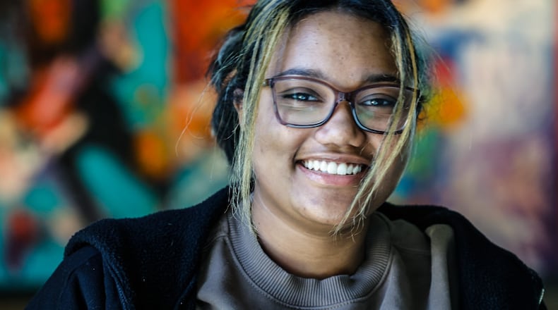 Trotwood senior Olivia Cox is the first in her family to go to college. She plans to attending Central State University in the fall. JIM NOELKER/STAFF