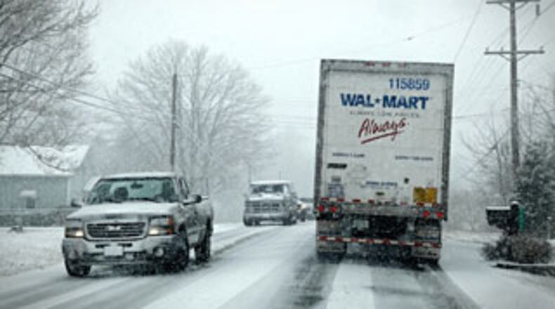 Drivers found themselves stuck on Ohio 63 in Lebanon at about noon on Wednesday Feb. 13, 2013, as snow falls. (Jim Noelker/Staff)