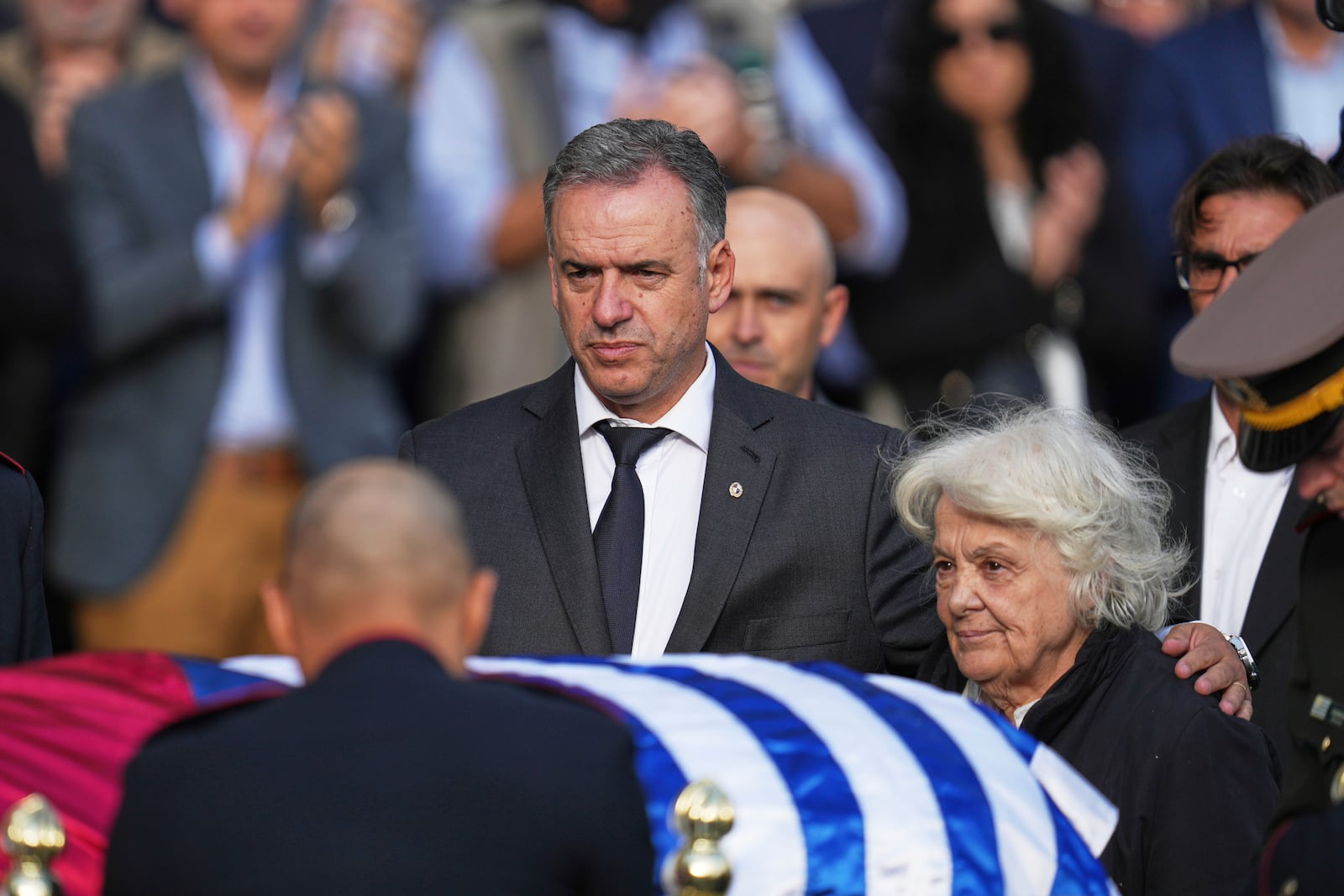Uruguay's President Yamandu Orsi, left, and Lucia Topolansky pay respects in front of the casket of late former Uruguayan President Jose Mujica at the presidential palace in Montevideo, Uruguay, Wednesday, May 14, 2025. (AP Photo/Matilde Campodonico)