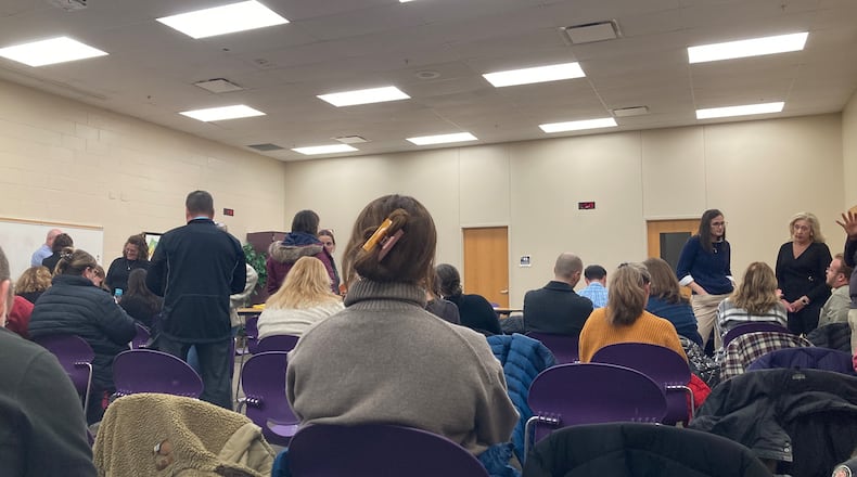 About 50 people attended a hastily called Bellbrook-Sugarcreek school board meeting Tuesday night, after a right-wing media group released a video featuring a member of Bellbrook's staff. Eileen McClory / staff