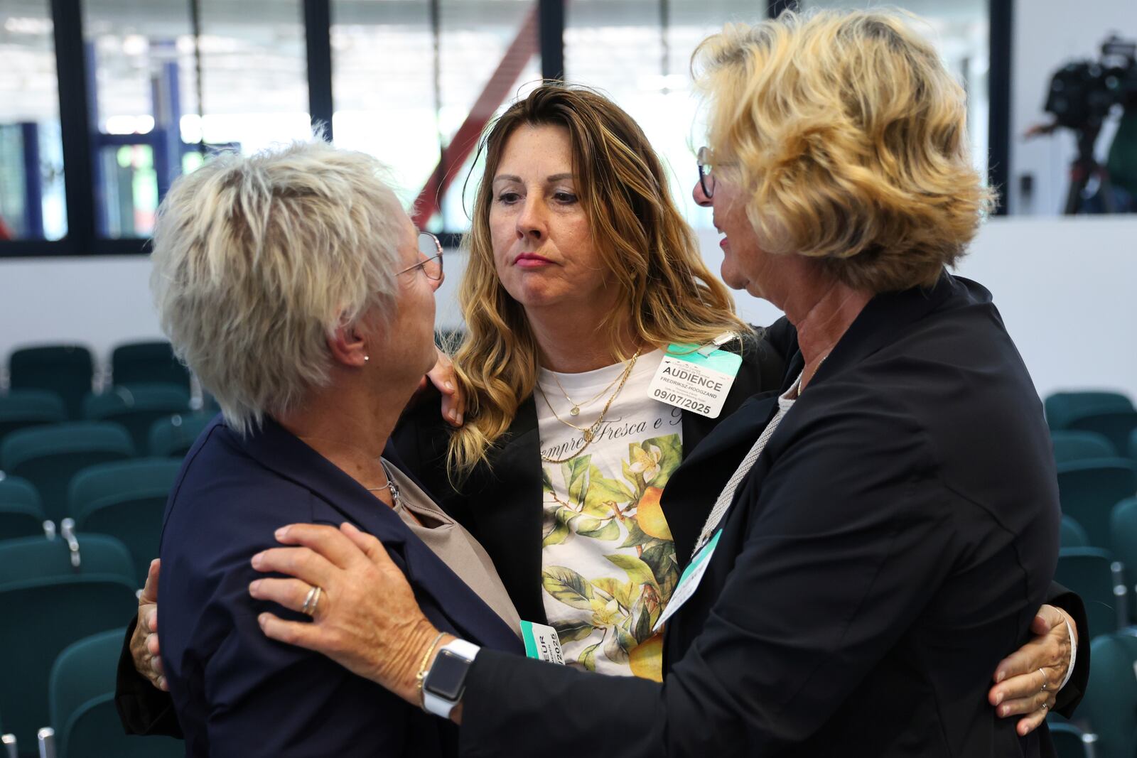 Netherlands' Silene Fredriksz-Hoogzand, center, whose son died in in the MH17 crash, hugs other plaintiffs after the European Court of Human Rights issued its judgment on Russian violations in Ukraine since 2014, including the downing of Malaysia Airlines flight MH17, Wednesday, July 9, 2025 in Strasbourg, eastern France. (AP Photo/Antonin Utz)