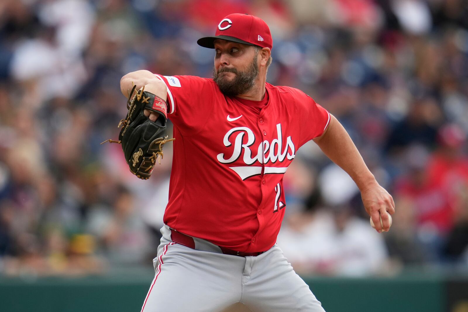 Cincinnati Reds' Wade Miley pitches in the first inning of a baseball game against the Cleveland Guardians in Cleveland, Monday, June 9, 2025. (AP Photo/Sue Ogrocki)
