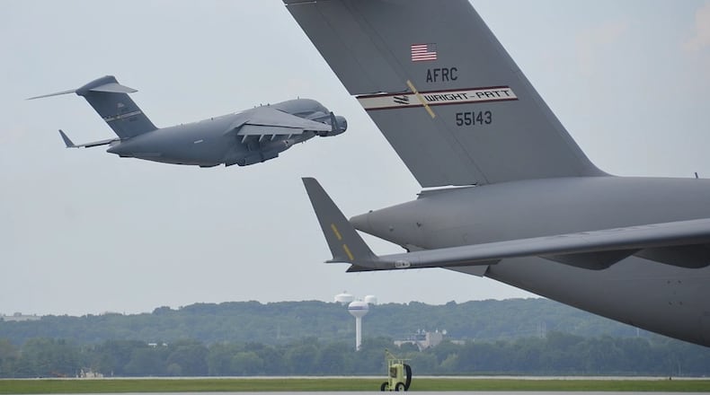 A C-17 Globemaster III aircraft takes off from a runway on August 15, 2020, at Wright Patterson Air Force Base. This particular C-17 is part of the 445th Airlift Wing, home to nine C-17s and nearly 2,000 Reserve Citizen Airmen. (U.S. Air Force photo by Staff Sgt. Ethan G. Spickler)