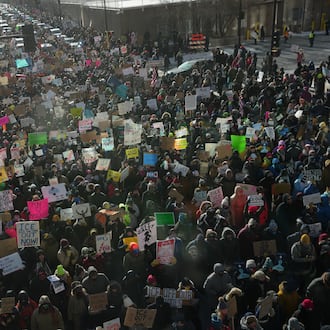 People protest against Federal immigration agents on Friday, Jan. 23, 2026, in Minneapolis. (AP Photo/Angelina Katsanis)