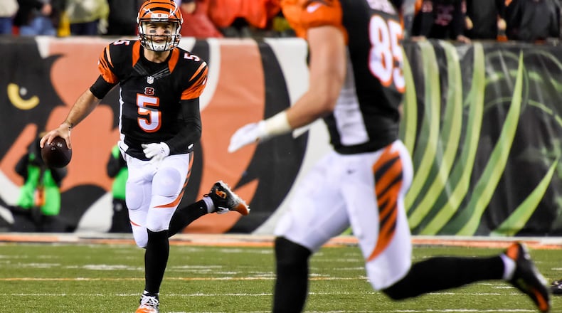 Cincinnati Bengals quarterback AJ McCarron scrambles with the ball during their18-16 loss to the Pittsburgh Steelers in the AFC wild card playoff game Saturday, Jan. 9 at Paul Brown Stadium in Cincinnati. NICK GRAHAM/STAFF