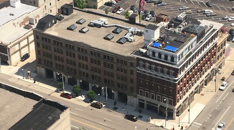The new developer of the Fire Blocks buildings in downtown Dayton began work on the stalled project. STAFF/CORNELIUS FROLIK