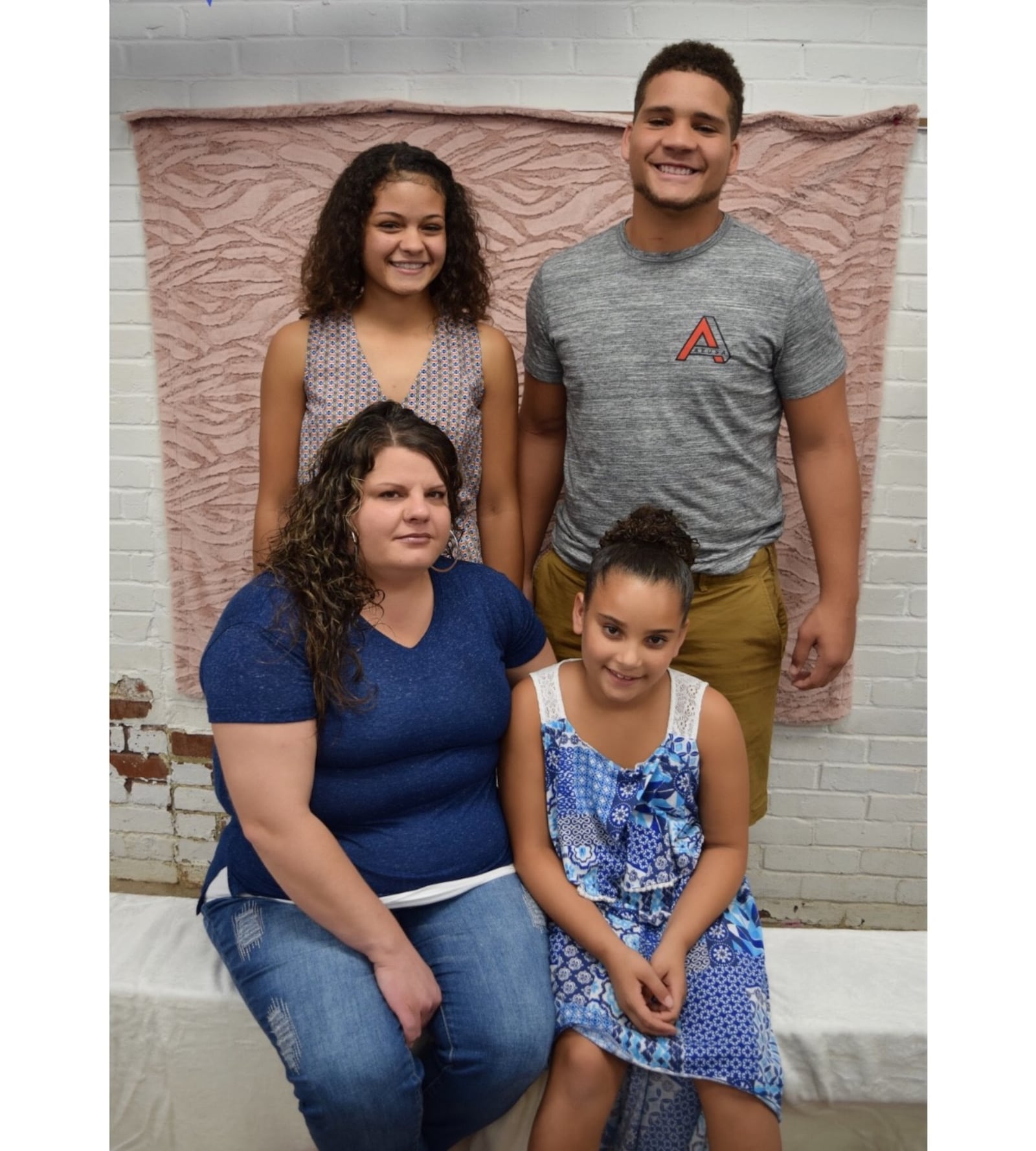 Jerell Lewis a few years back with his sister, Jordaya Walker, next to him and his late mother Elizabeth Lewis and his youngest sister, Treasure Higgins, in front. CONTRIBUTED