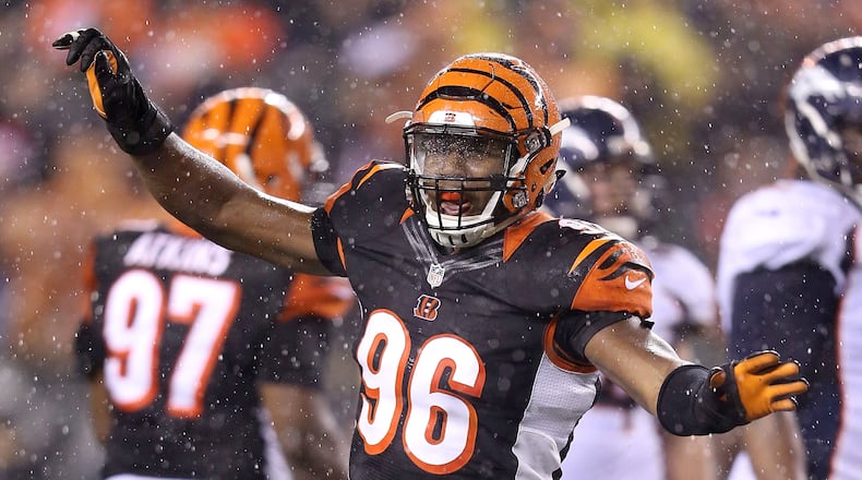 CINCINNATI, OH - DECEMBER 22: Carlos Dunlap #96 of the Cincinnati Bengals celebrates after sacking Peyton Manning #18 of the Denver Broncos during the fourth quarter at Paul Brown Stadium on December 22, 2014 in Cincinnati, Ohio. Cincinnati defeated Denver 37-28. (Photo by Andy Lyons/Getty Images)