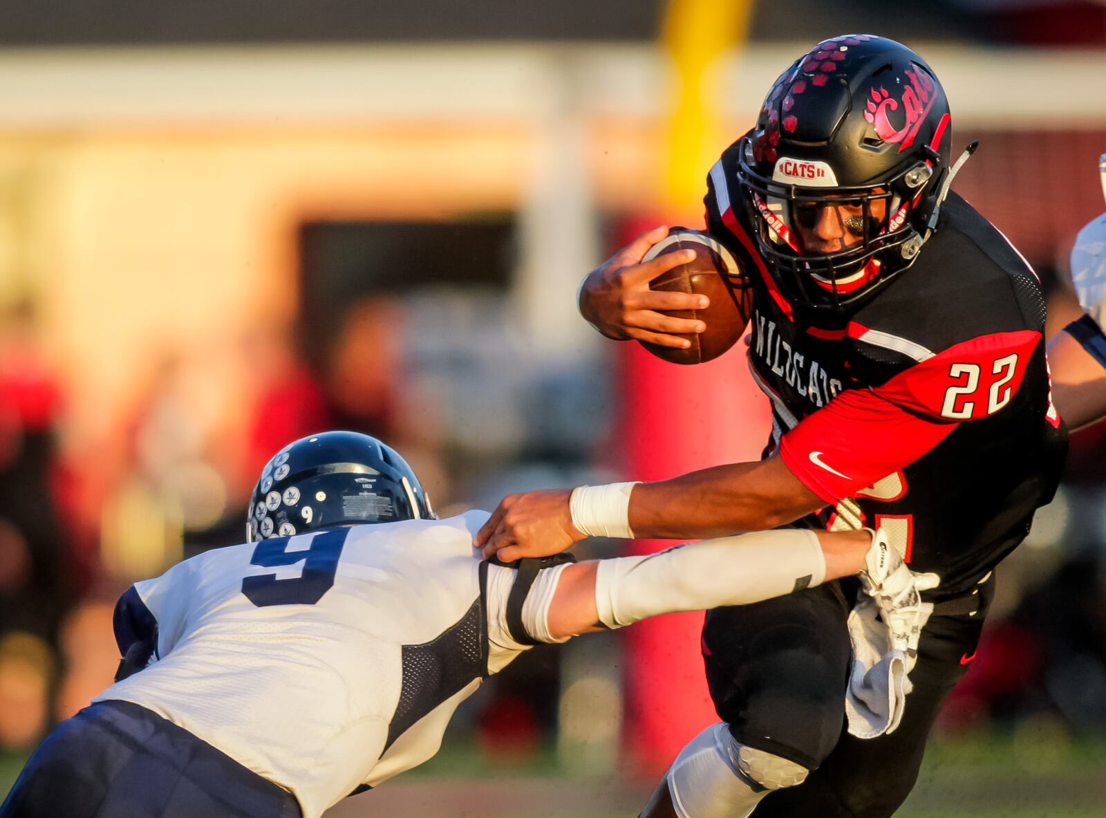 Valley View’s Lane Murphy tries to tackle Franklin’s Ryan Montgomery as he carries the ball during their game Friday, Sept. 23 at Veterans Memorial Field at Atrium Stadium in Franklin. The Wildcats defeated the Spartans 41-8. NICK GRAHAM/STAFF