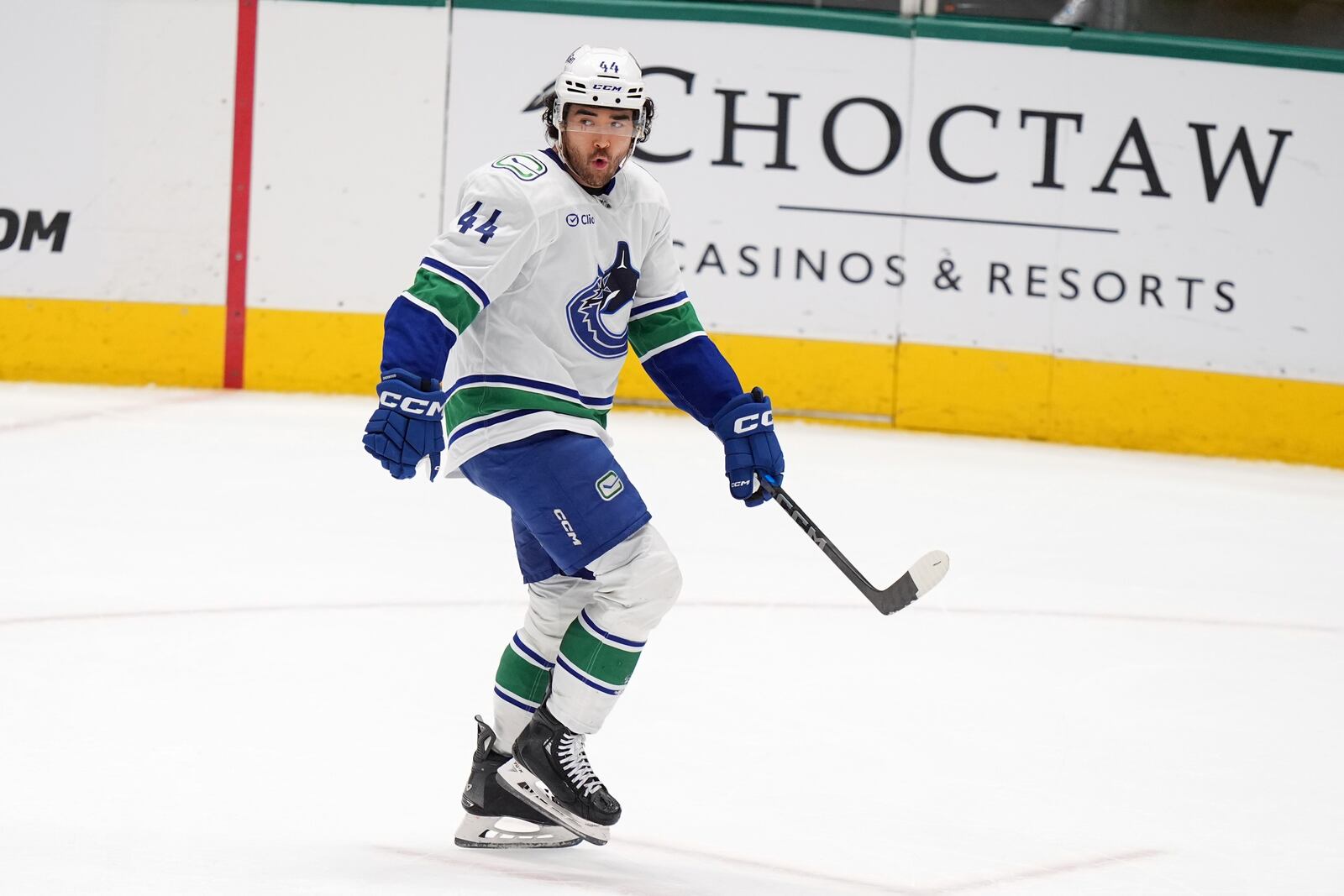 Vancouver Canucks left wing Kiefer Sherwood celebrates after scoring against the Dallas Stars in overtime of an NHL hockey game in Dallas, Tuesday, April 8, 2025. (AP Photo/LM Otero)