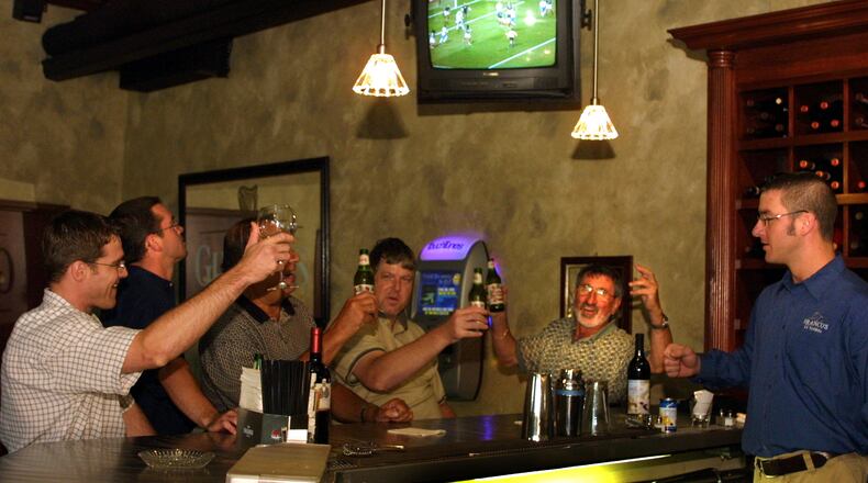 Hoisting Italian beer, a small gathering watch the World Cup soccer replay match between Mexico and Italy at Franco’s Ristorante Italiano at 824 E. 5th St. in Dayton. Owner Franco Germano, second from right also watched the game live at 7:30 a.m. with invited guests at the eatery. DDN FILE PHOTO