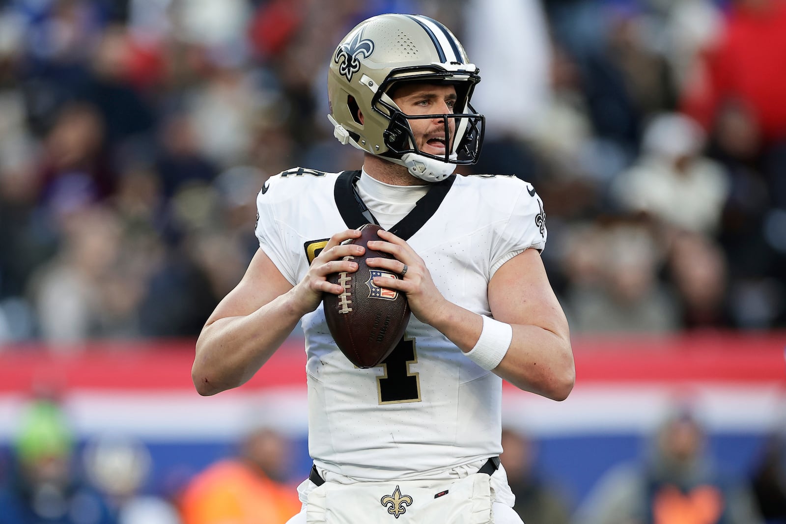 FILE - New Orleans Saints quarterback Derek Carr (4) looks to pass the ball during an NFL football game against the New York Giants, Dec. 8, 2024, in East Rutherford, N.J. (AP Photo/Adam Hunger, File)