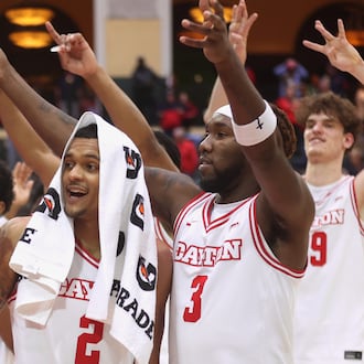 Dayton players leave the court after a victory against Georgetown on Thursday, Nov. 27, 2025, at the State Farm Field House in Kissimmee, Fla. David Jablonski/Staff