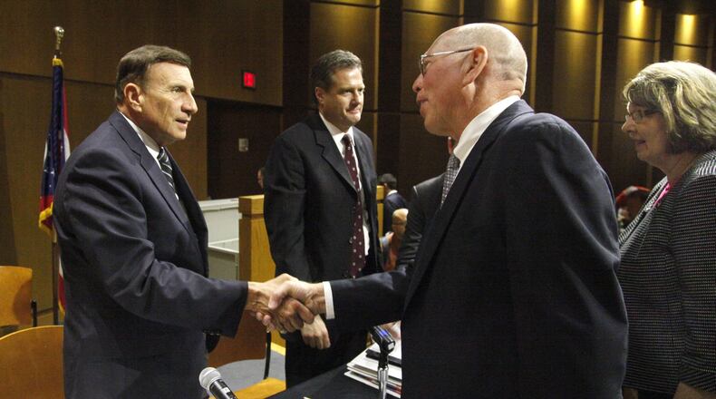 The House Oversight & Government Reform Subcommittee on Government Operations held a field hearing in 2013 at Sinclair Community College in Dayton on how the pensions of Delphi salaried retirees were treated. U.S. Rep. John Mica (R-FL) (left) and U.S. Rep. Mike Turner (right) greet Tom Rose and Mary Miller, both of Washington Township, after they participated on a panel representing the Delphi Salaried Retirees Association. LISA POWELL / STAFF