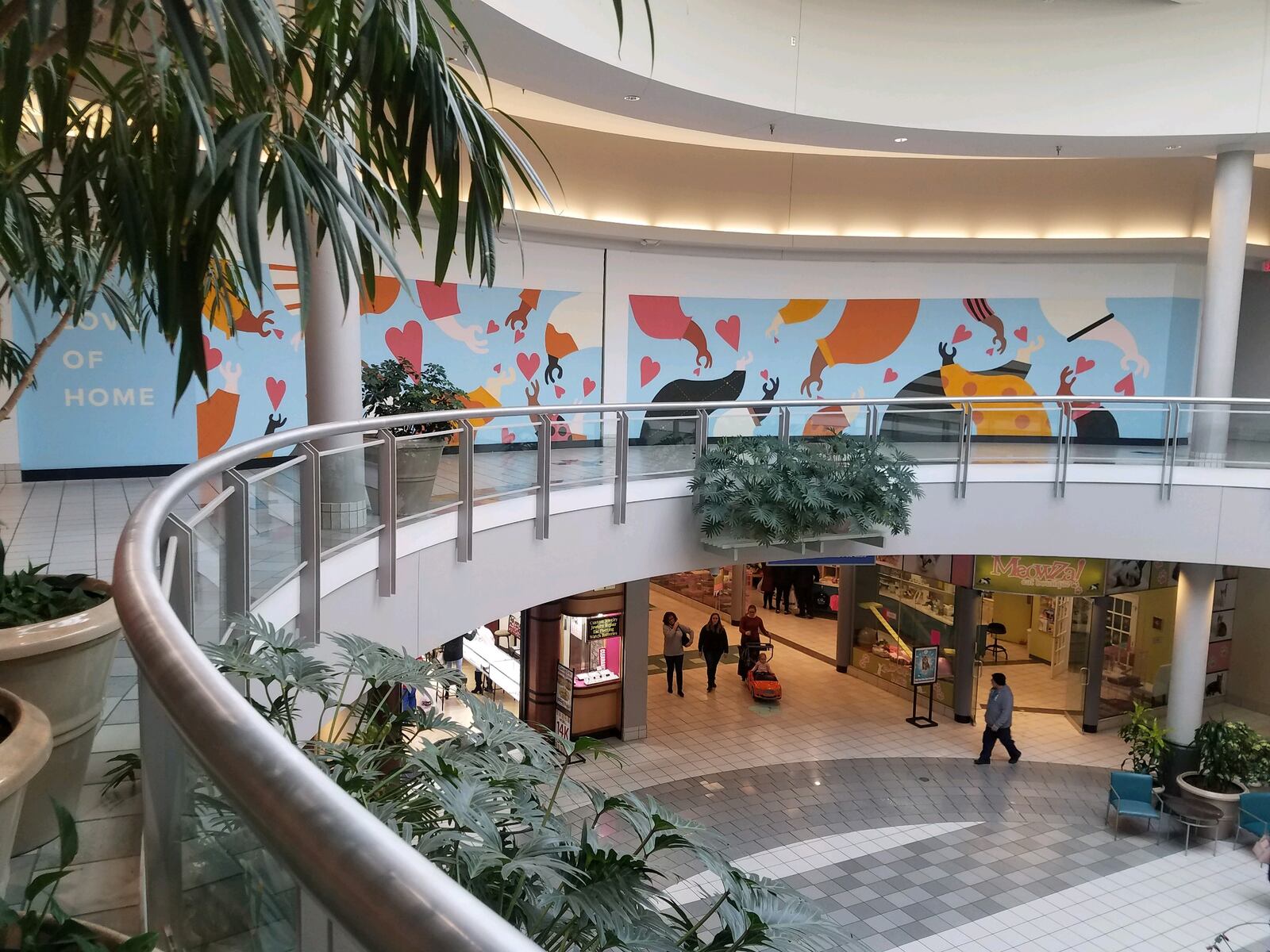 A new mural at the Dayton Mall, "Love of Home," is hoping to inspire residents of Dayton to give love after the tragedies of the previous year.