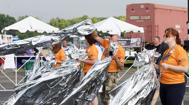 The Air Force Marathon has signed on to the United Nations Framework Convention on Climate change to continue their efforts to make a difference in the environment and community by minimizing waste and improve conservation. One of the several initiatives that will be taken at this year’s marathon is heat sheets handed out to runners at the finish line will now be made of recycled material and after use will be collected and recycled into other products. (U.S. Air Force photo/Michelle Gigante)