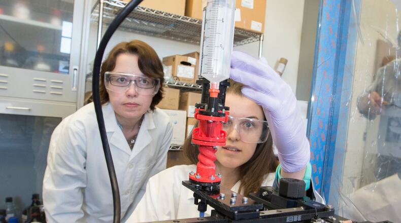 Jessica Sparks, associate professor in chemical, paper and biomedical engineering at Miami University, and then-graduate student Katie Bootsma work with a MakerGear 3D Printer. Dr. Sparks is the lead faculty member on the RAPIDS grant at Miami. (Miami University photo)