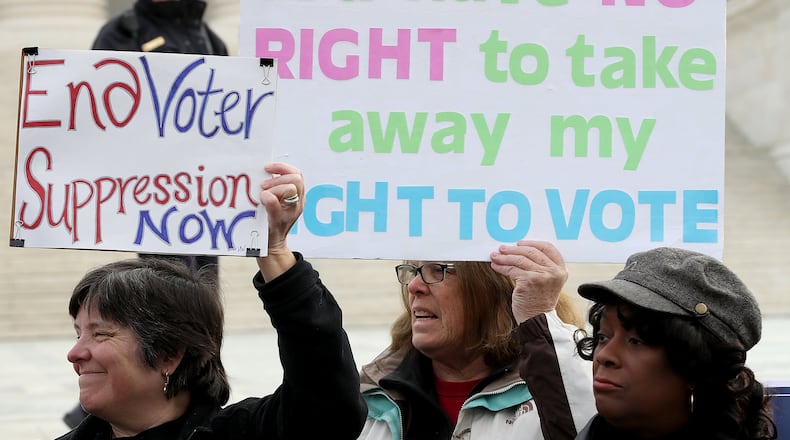 Protesters gather during a rally held by the group Common Cause in front of the U.S. Supreme Court Jan. 10, 2018, to protest Ohio’s voter purge law. (Photo by Win McNamee/Getty Images)