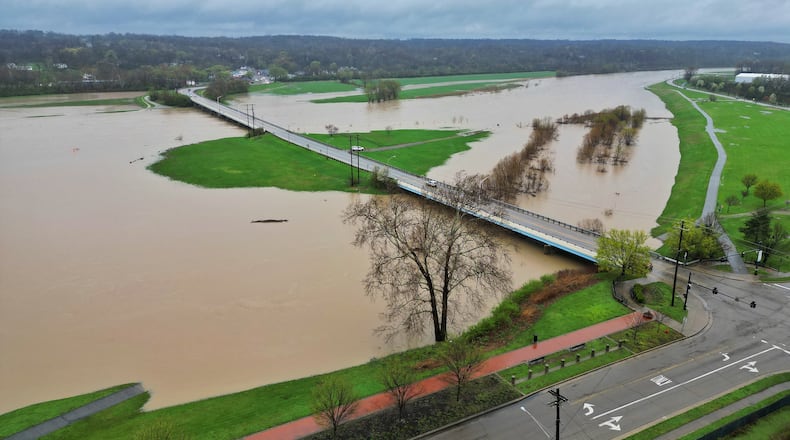 The level of the Great Miami River is up after several days of heavy rain Saturday, April 5, 2025 near the Ohio 122 bridge in Middletown. NICK GRAHAM/STAFF