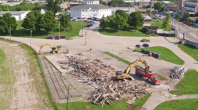 Remnants of the demolished Grandstand at the old Montgomery County Fairgrounds are sorted for recycling. Demolition has begun on about 22 buildings at the site - the first visible signs of work to redevelop the property. After 165 years in Dayton, the Montgomery County Fair moved to a new home in Jefferson Twp. last year. TY GREENLEES / STAFF