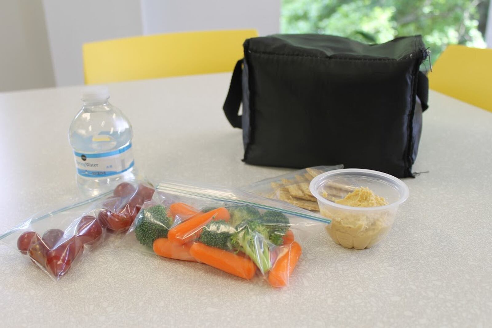 A photo by Children’s Healthcare of Atlanta’s Strong4Life program shows a healthy lunch of hummus, whole-wheat crackers, grapes and bottled water.