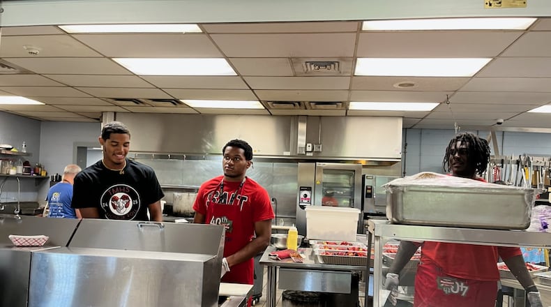 Trotwood Madison senior football players volunteered at House of Bread last week.
Contributed