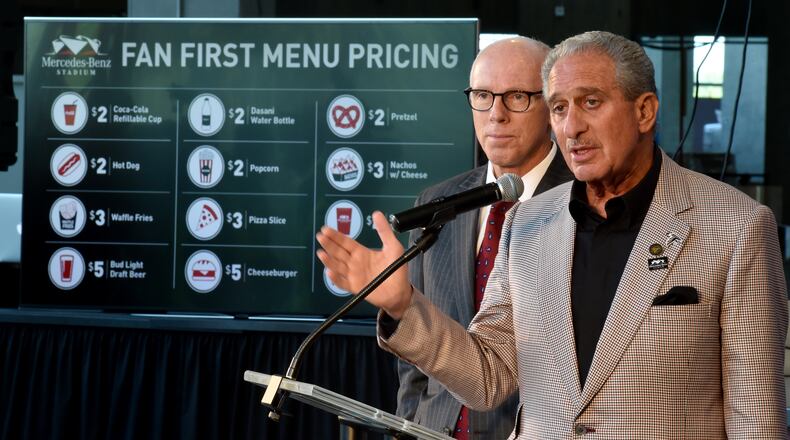 The Atlanta Falcons gave a preview of food set for the new Mercedes Benz Stadium on Wednesday. Atlanta Falcons owner Arthur Blank, right, and Falcons President Rich McKay earlier this year unveiled a plan to buck sports-industry tradition by sharply reducing prices on some popular food and beverage items at the new venue. BRANT SANDERLIN/BSANDERLIN@AJC.COM