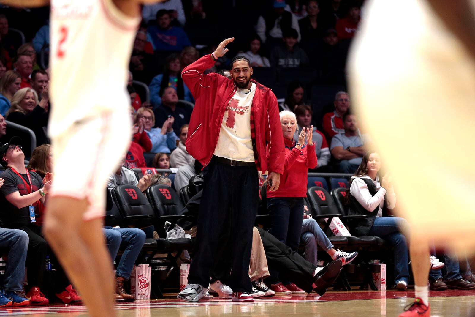 Obi Toppin gets on his feet to celebrate one of the many dunks made by the current Dayton Flyers during the North Florida game on Saturday, Dec. 13, 2025 at UD Arena. STEVEN WRIGHT / STAFF